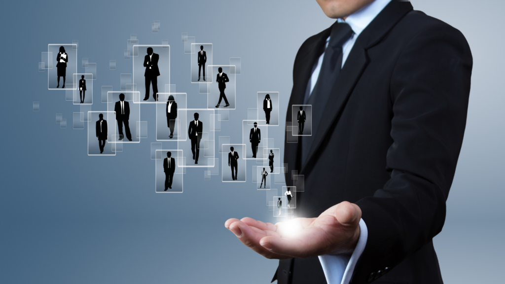 An edit showing a man holding other people up in the palm of his hand