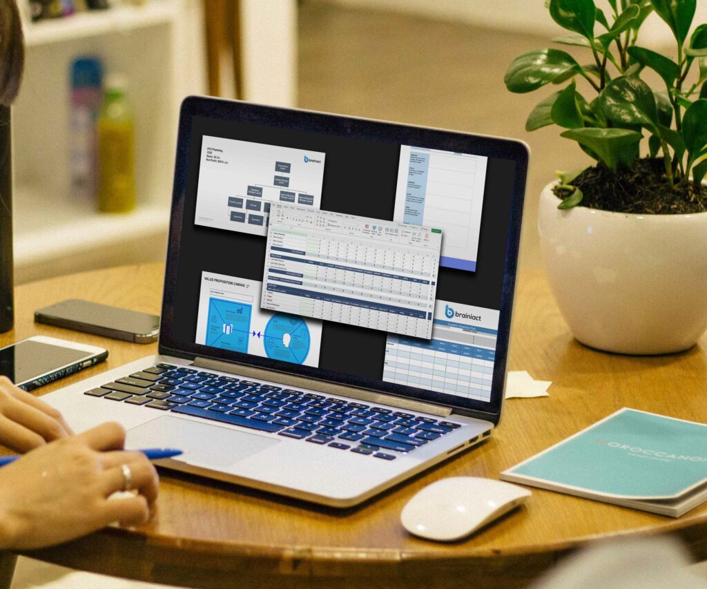 laptop with spreadsheets and templates on the screen on a coffee table