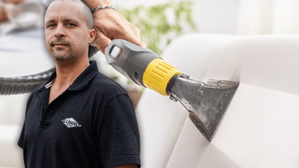 A man in a black shirt with the "Billingsly Group" logo stands in front of a close-up image of a professional upholstery cleaning tool being used on a white couch.