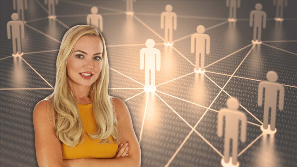 women stands in front of figures connected together by lines representing a network