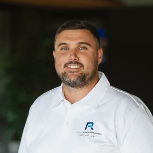 Male business owner smiling