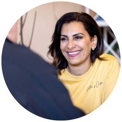 A female business owner smiling